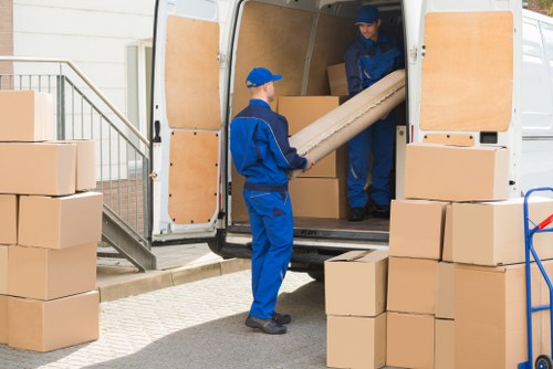 Flat removals team planning a move in Paddington street with apartment access