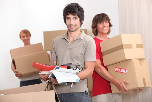 Careful wrapping and boxing of household items for a Paddington move