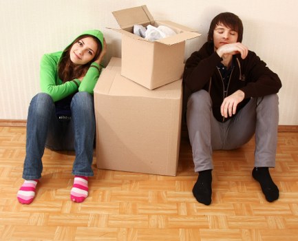 Secure self storage unit with stacked boxes and furniture