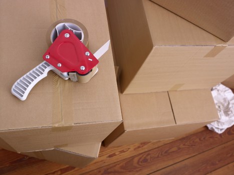 Packed boxes and furniture ready for mobile storage collection